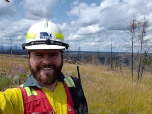A seasonal firefighter in the field