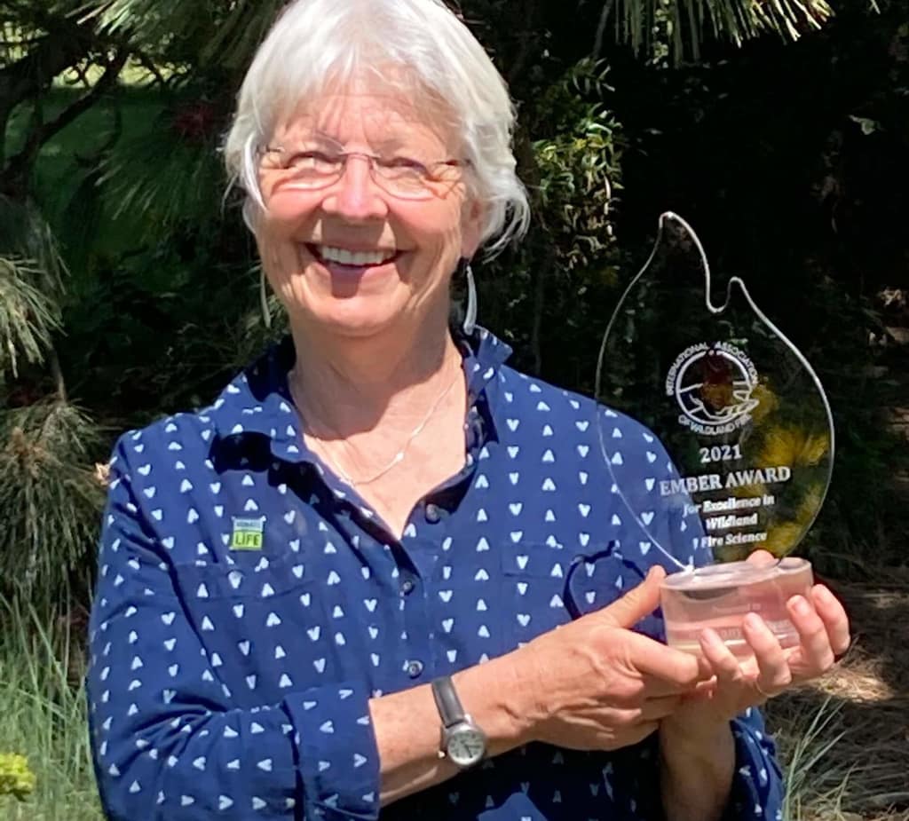 Dr. Penny Morgan with an IAWF award